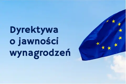 Dyrektywa o jawności wynagrodzeń od kiedy? Flaga UE na tle błękitnego nieba.